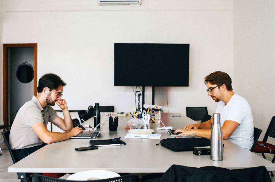The CLDev team at work around the office table
